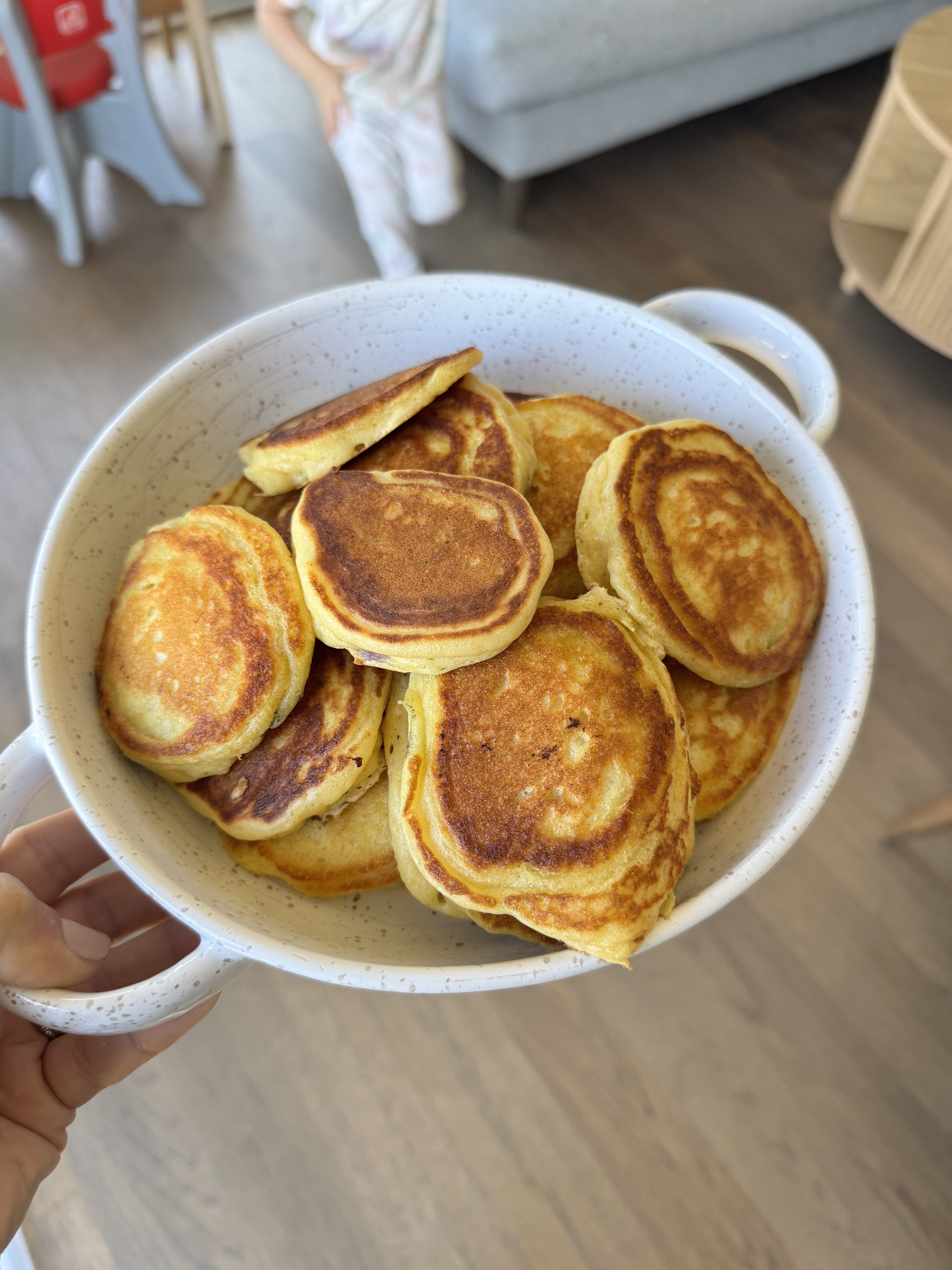 fluffy greek yogurt pancakes in white bowl overhead view