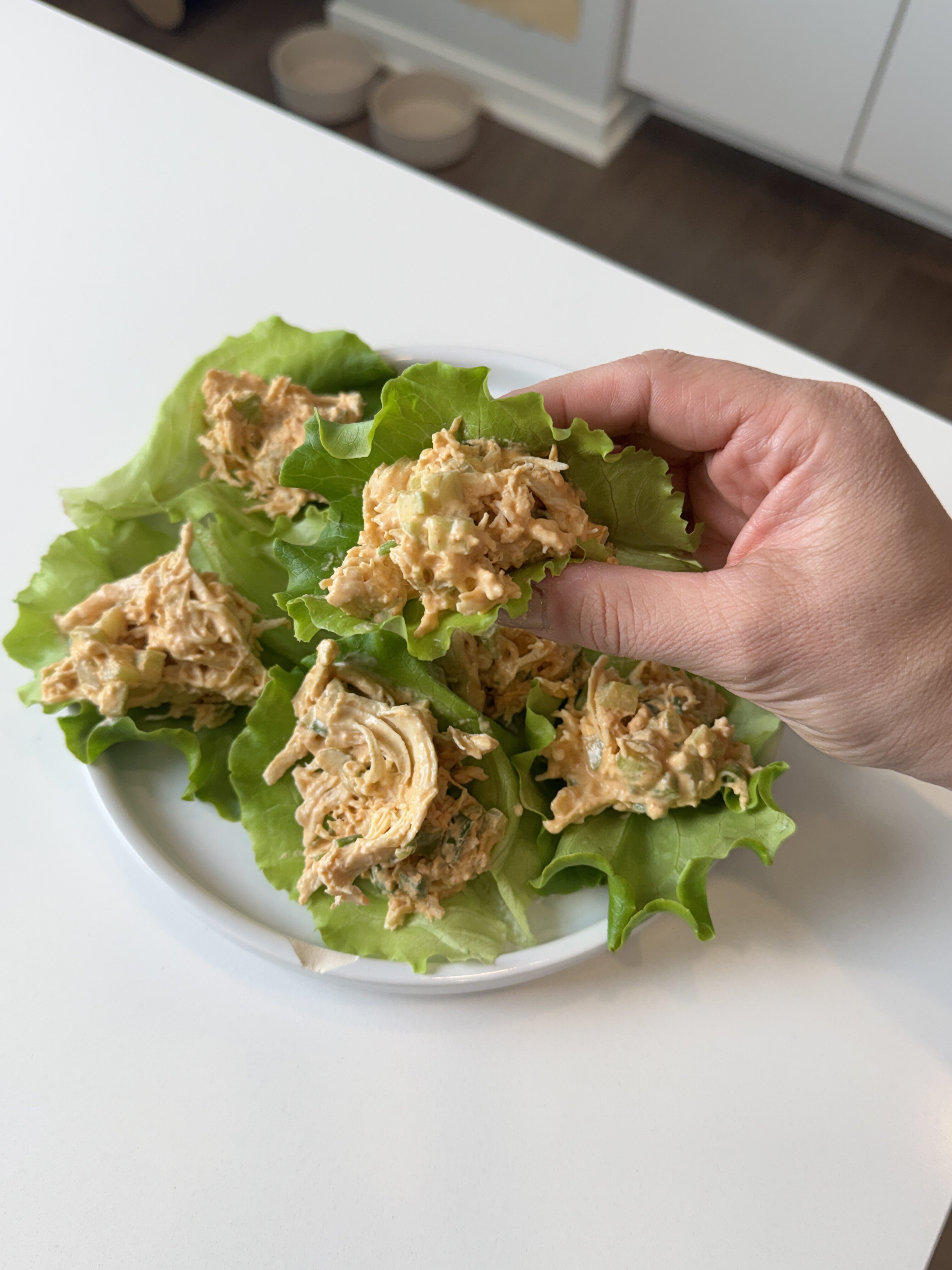 overhead view of buffalo chicken salad in a large bowl ready to serve