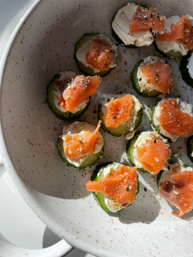 cucumber salmon bites in a white bowl overhead view