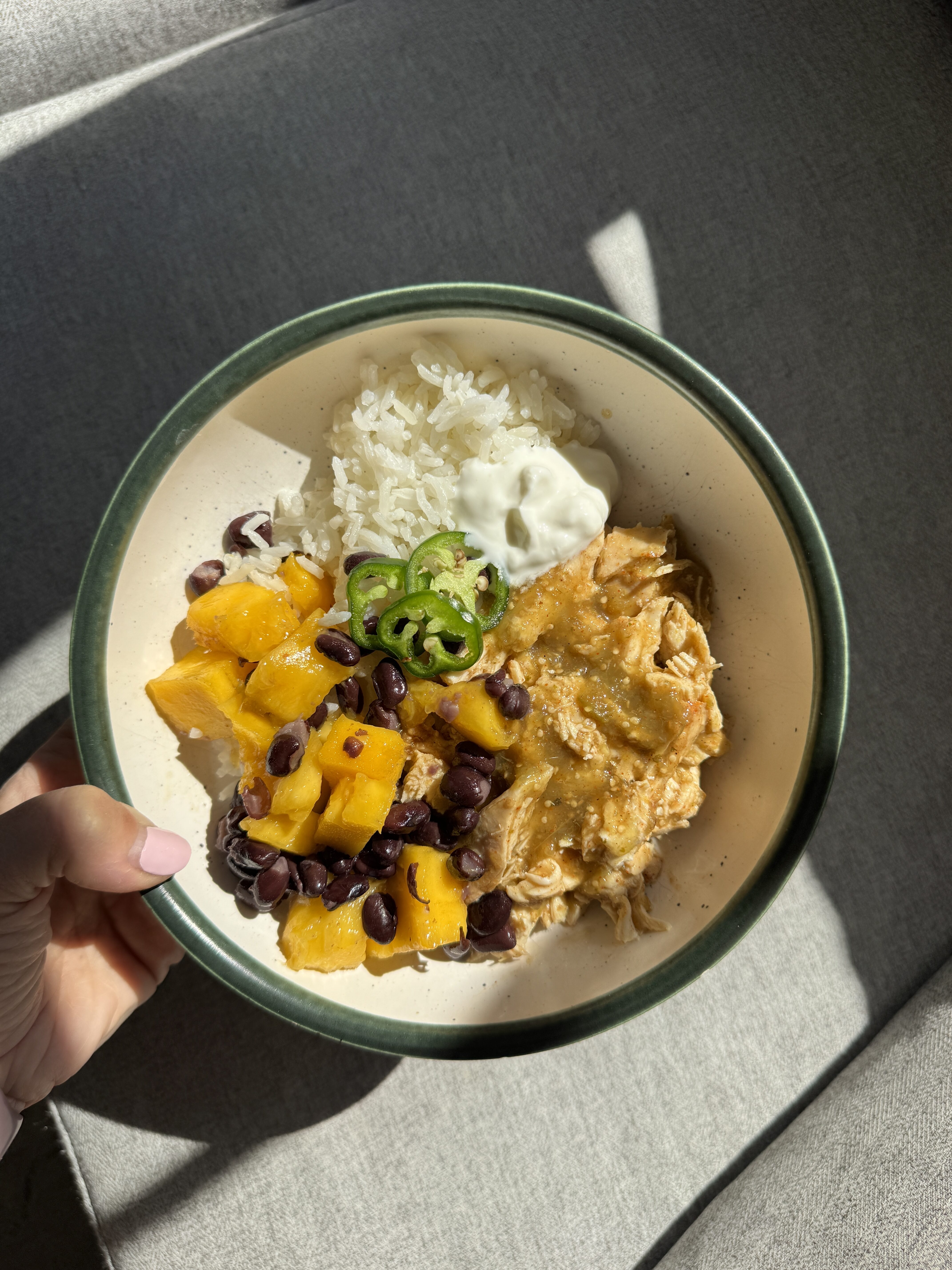 IMG_5071 Assembled salsa verde chicken bowl with rice, black beans, mango chunks, jalapeno slices and greek yogurt