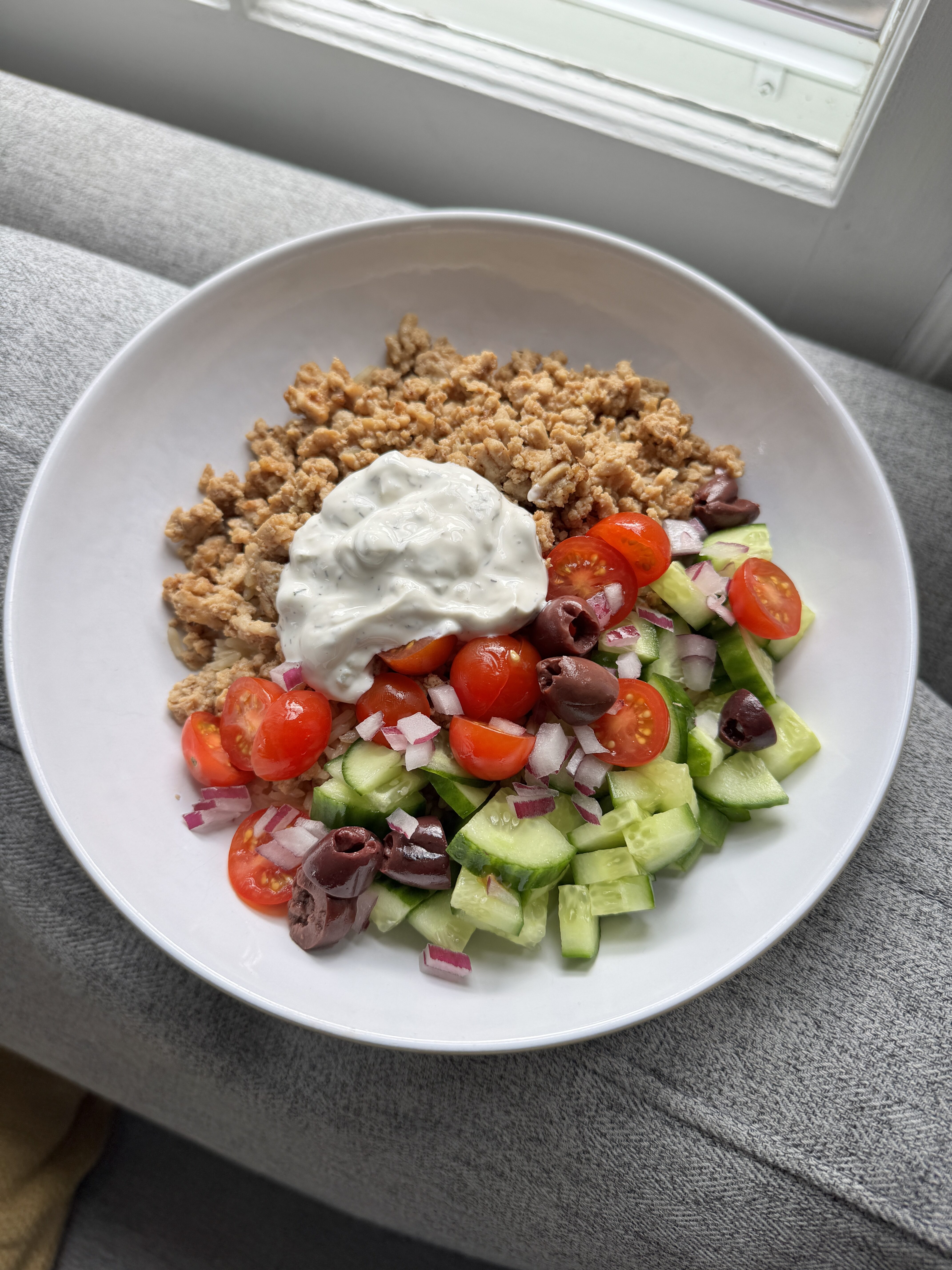 Ground chicken tzatziki bowls with rice, cucumber, tomato, feta and a spoonful of tzatziki