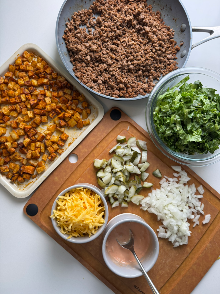 Easy cheeseburger bowls with seasoned beef, crispy potatoes, lettuce, pickles, and special sauce