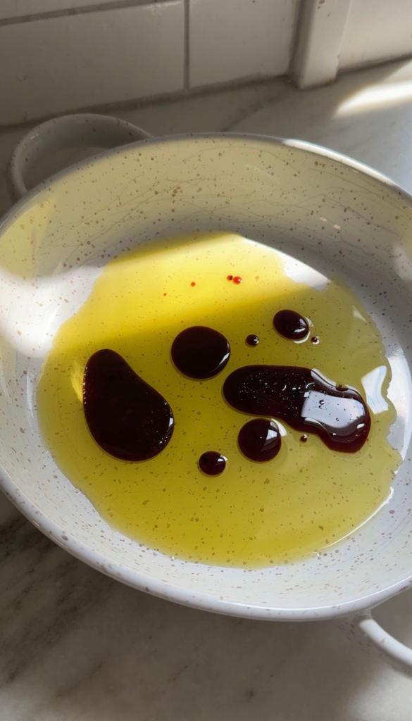 Simple olives and burrata appetizer with marinated olives, hot honey, and toasted sourdough