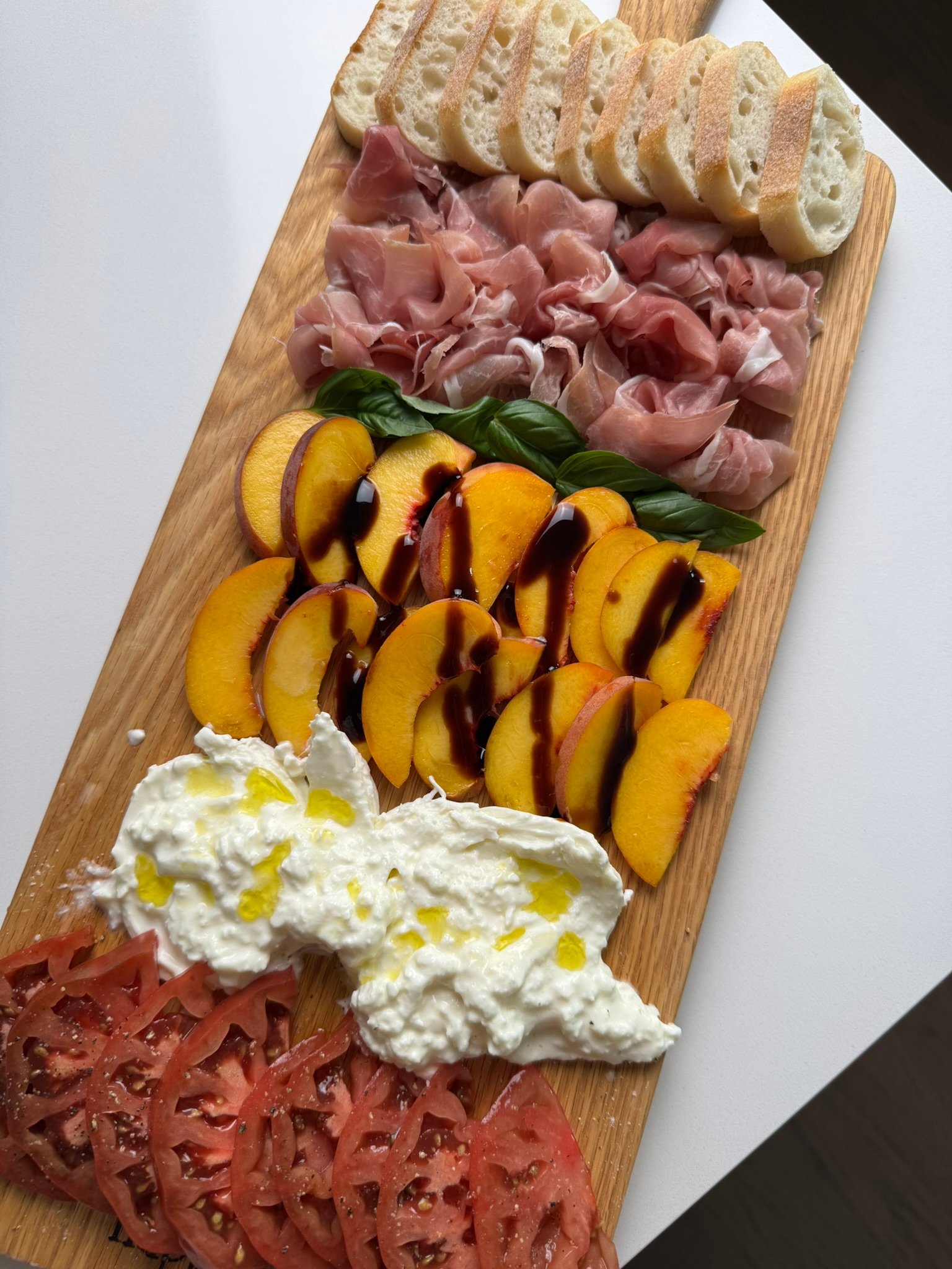 Summer burrata board with fresh sliced peaches