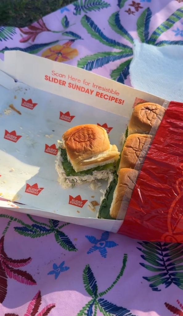 Dill pickle chicken sliders packed in the roll bag on a beach towel