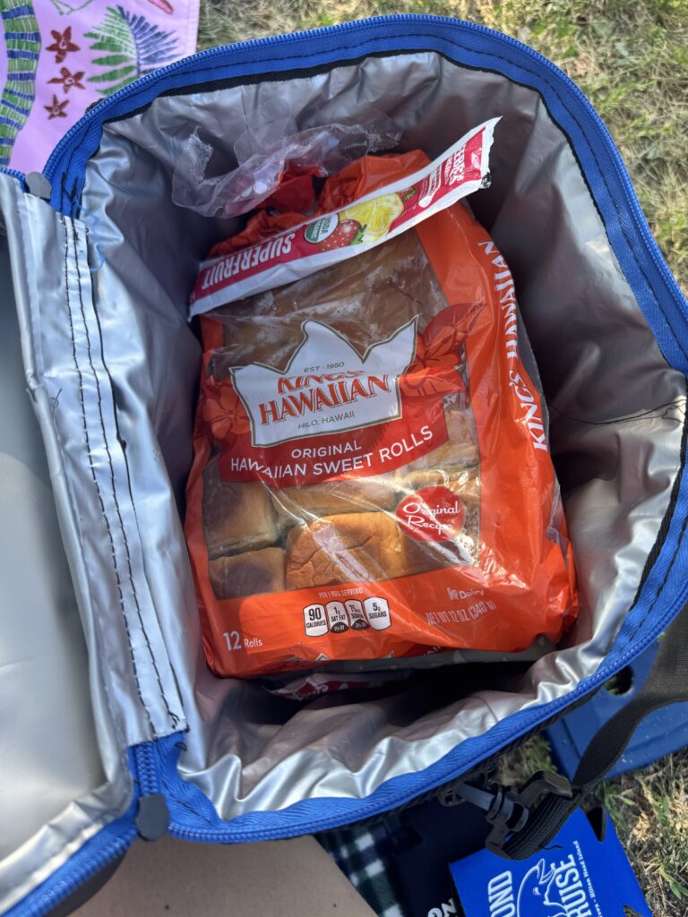 A pack of Kings Hawaiian sweet rolls packed in a cooler bag for the beach