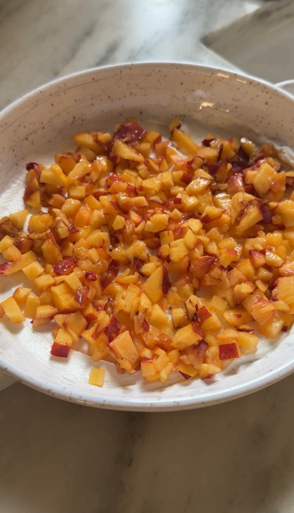 Diced fresh peaches layered over goat cheese for peach dip