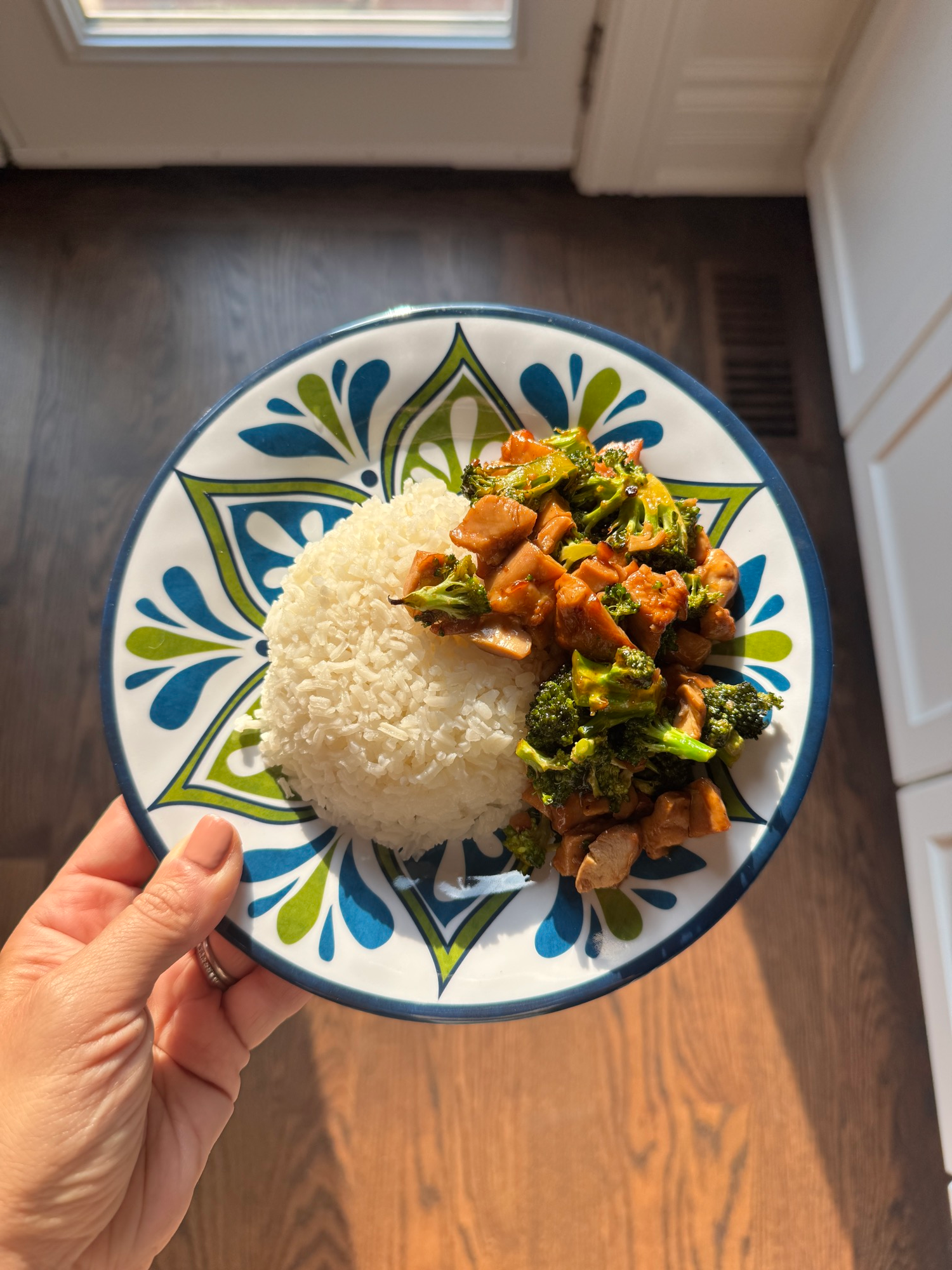Easy teriyaki chicken and broccoli served over rice on a plate