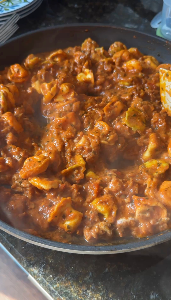 Cheese tortellini simmered in marinara and sausage sauce