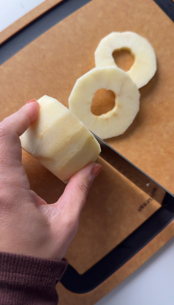 Slicing an apple into rings for apple cinnamon donuts