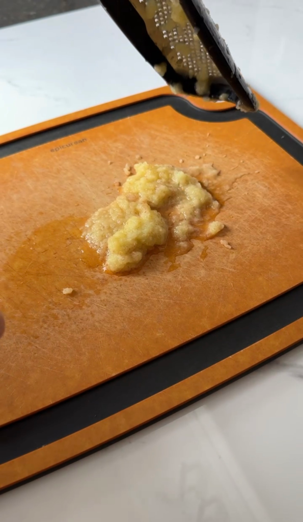 Grating fresh apple for apple banana muffins