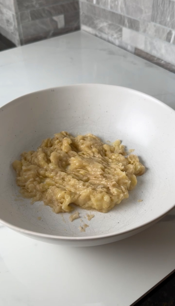 Mashed ripe banana in a bowl
