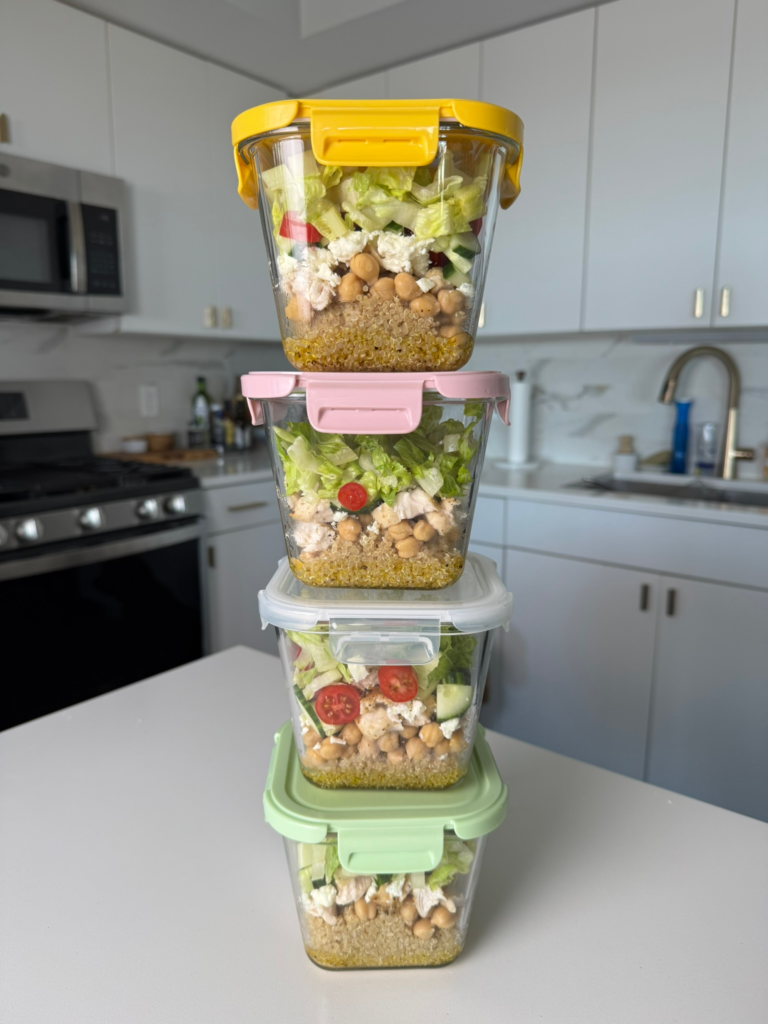 Stacked meal prep containers of chickpea chicken salad