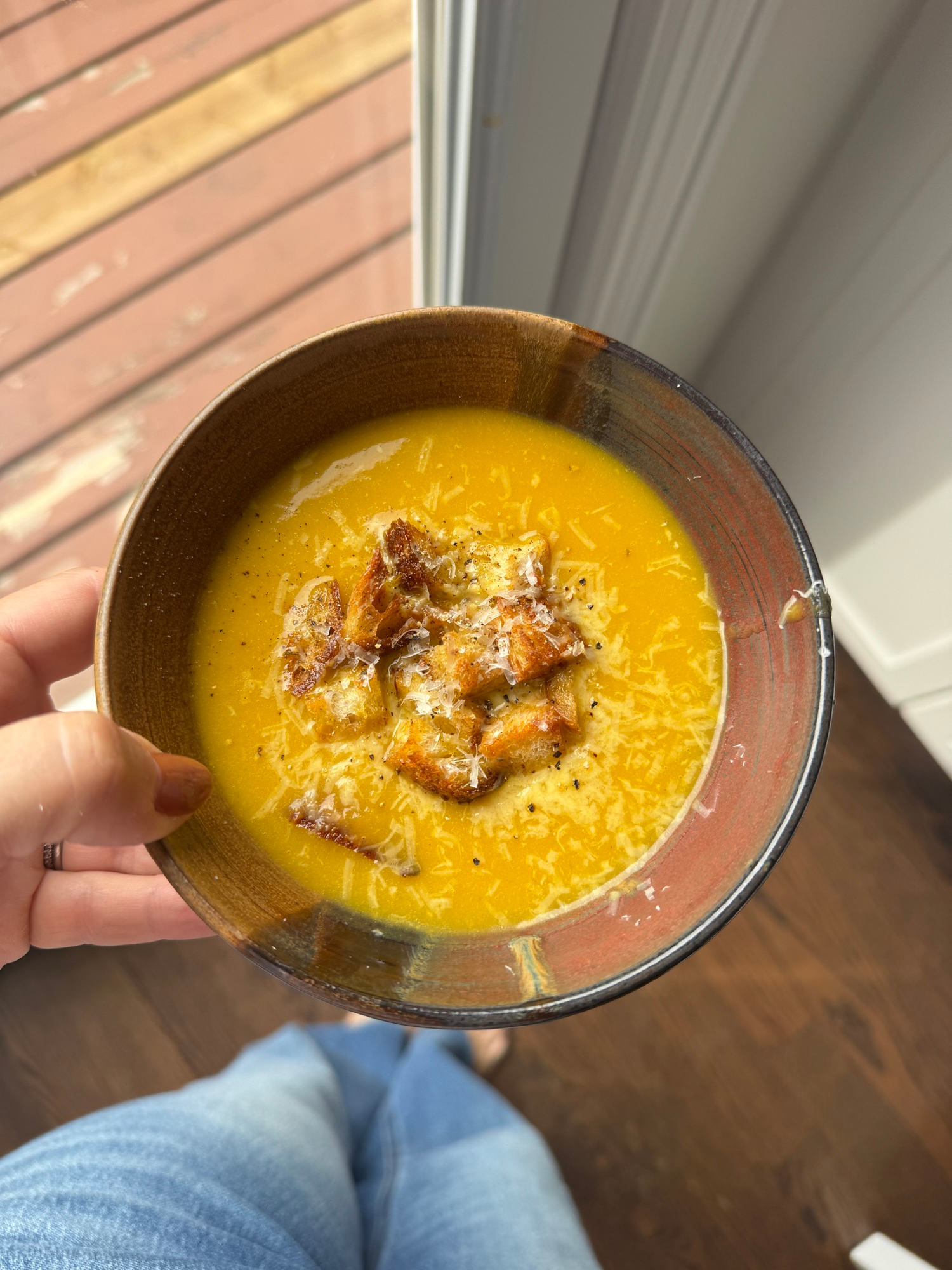 Easy blended vegetable soup in a bowl topped with crunchy homemade croutons