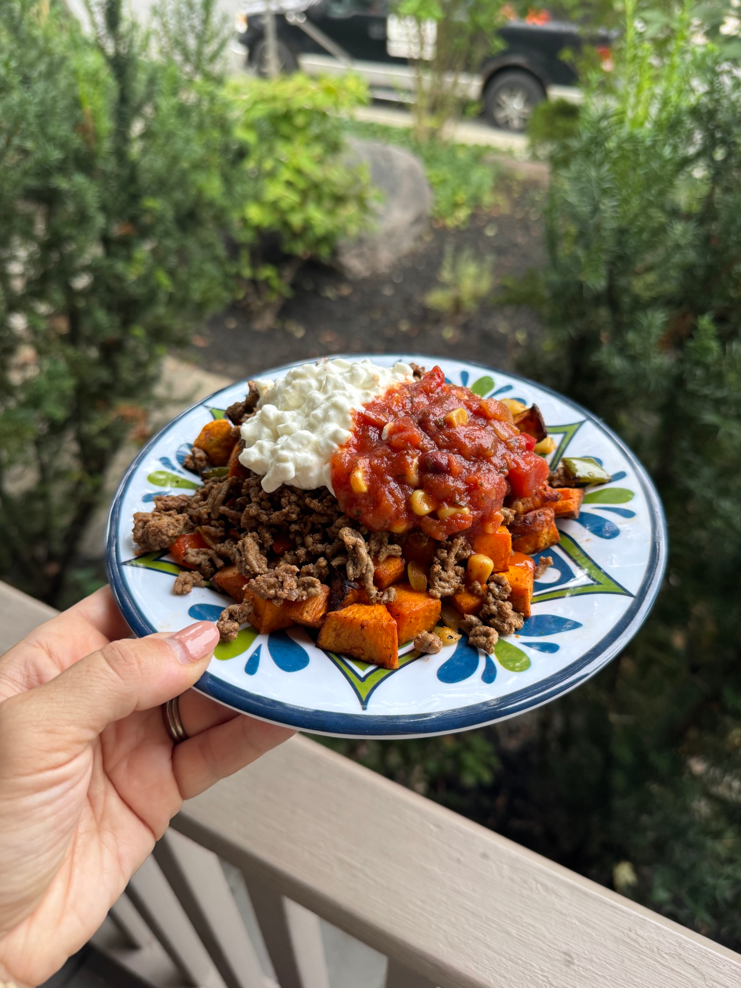 High protein sweet potato taco bowls topped with taco beef, cottage cheese, and salsa