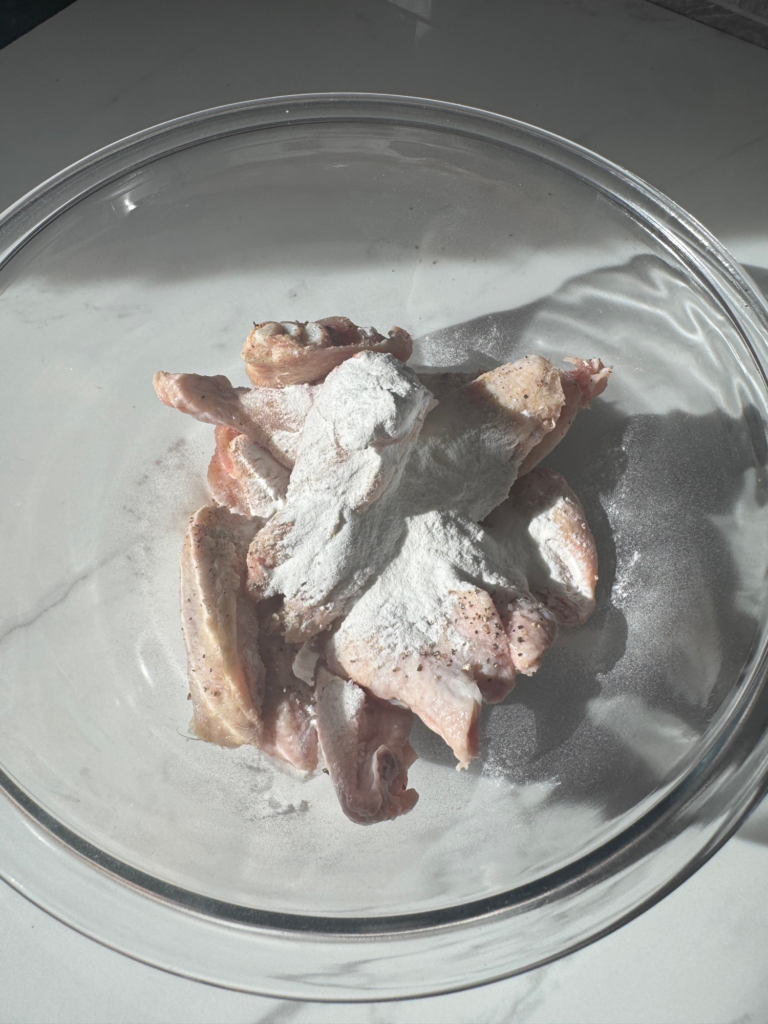 Chicken wings tossed with baking powder for crispy skin