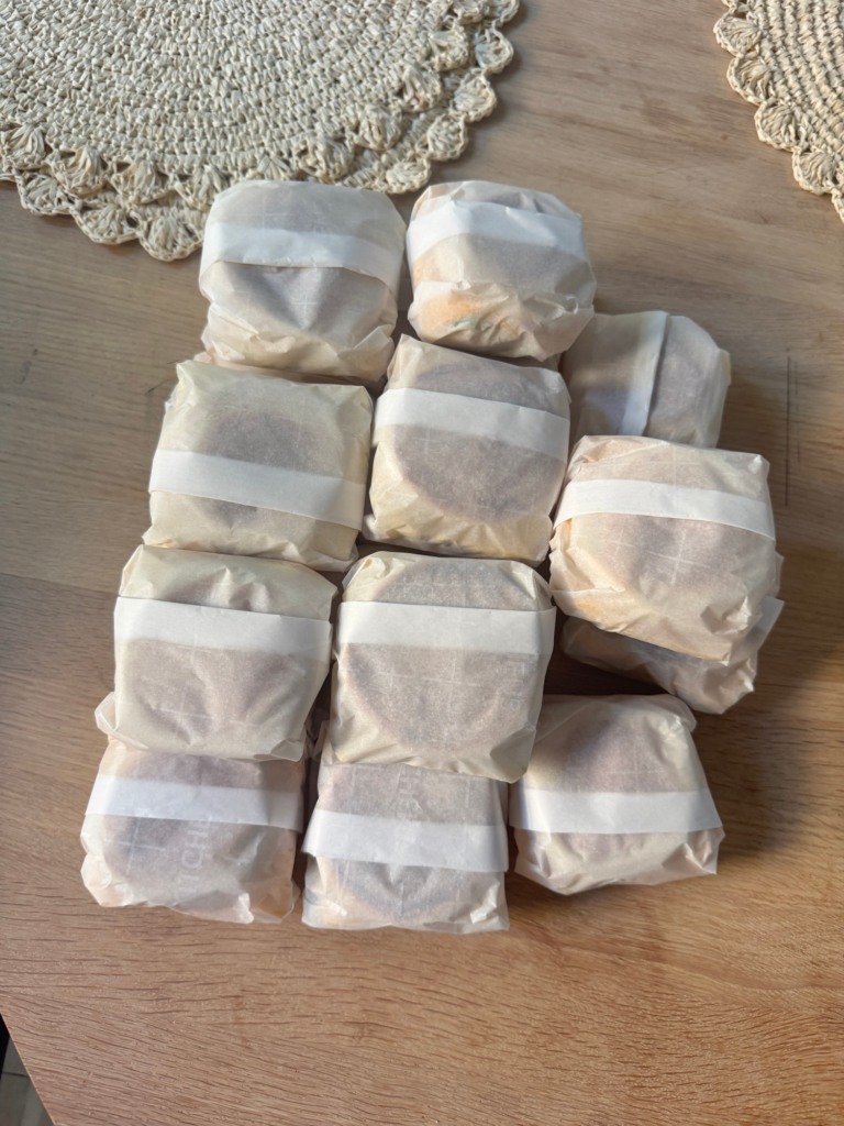 Make ahead breakfast sandwiches individually wrapped in parchment paper for the freezer
