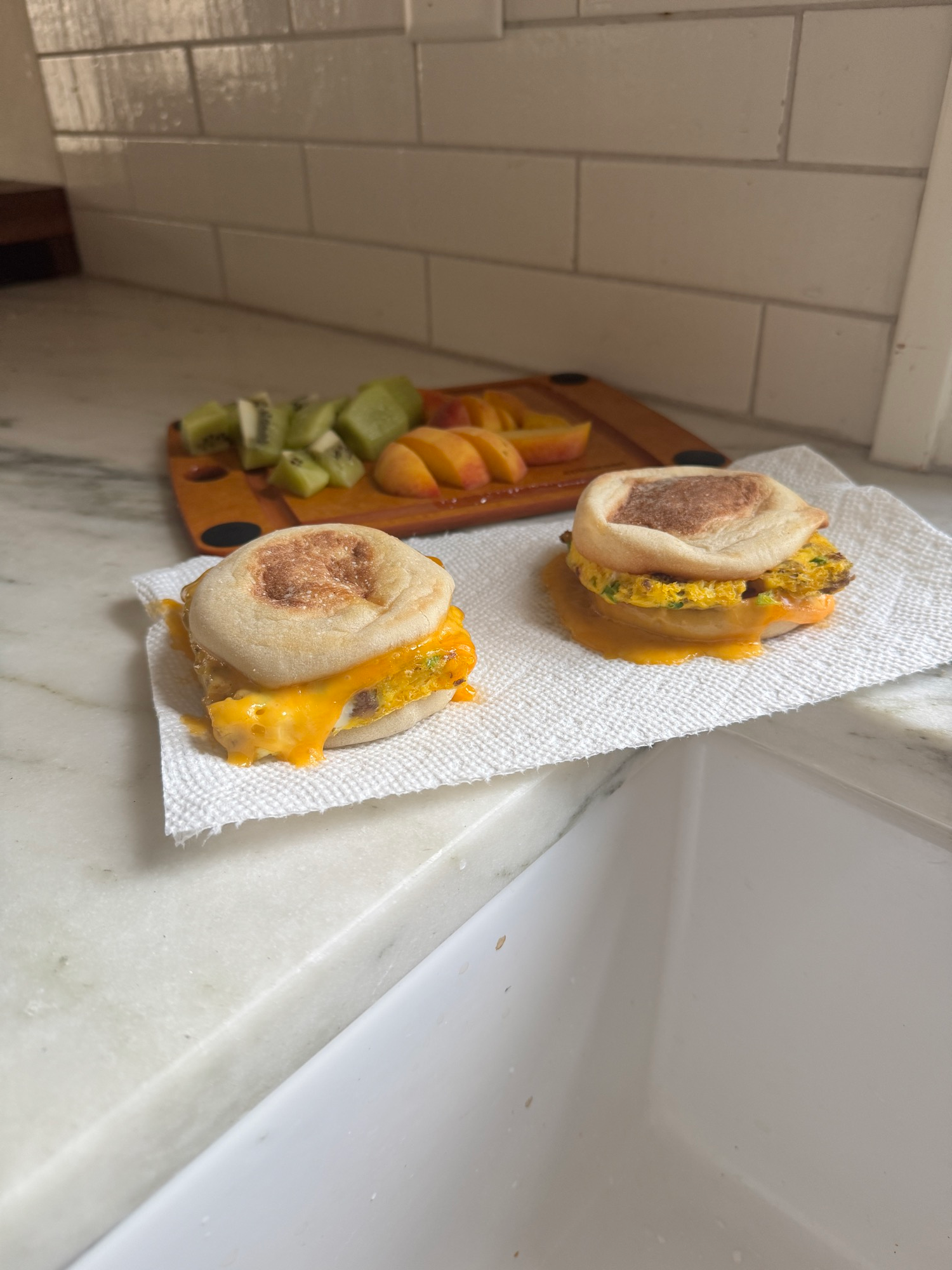 Make ahead breakfast sandwiches with sausage, egg, and melty cheddar on English muffins