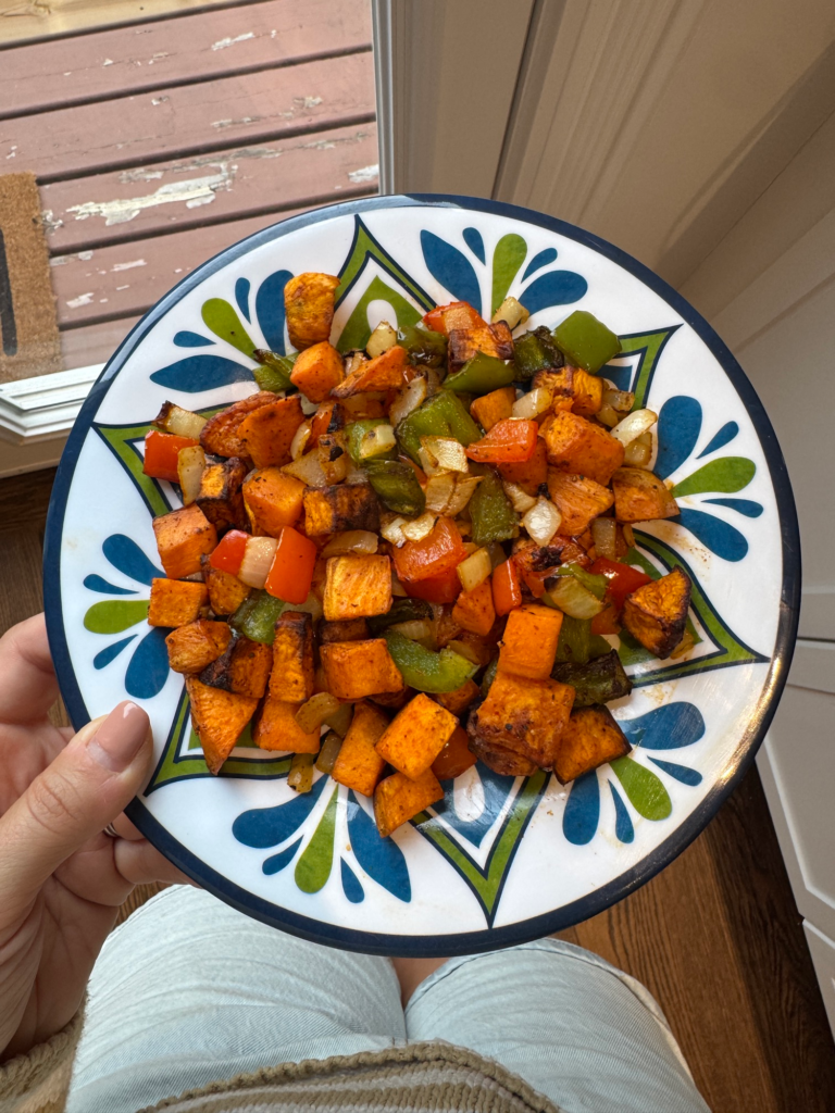 Air fryer roasted sweet potatoes, peppers, and onions on a plate