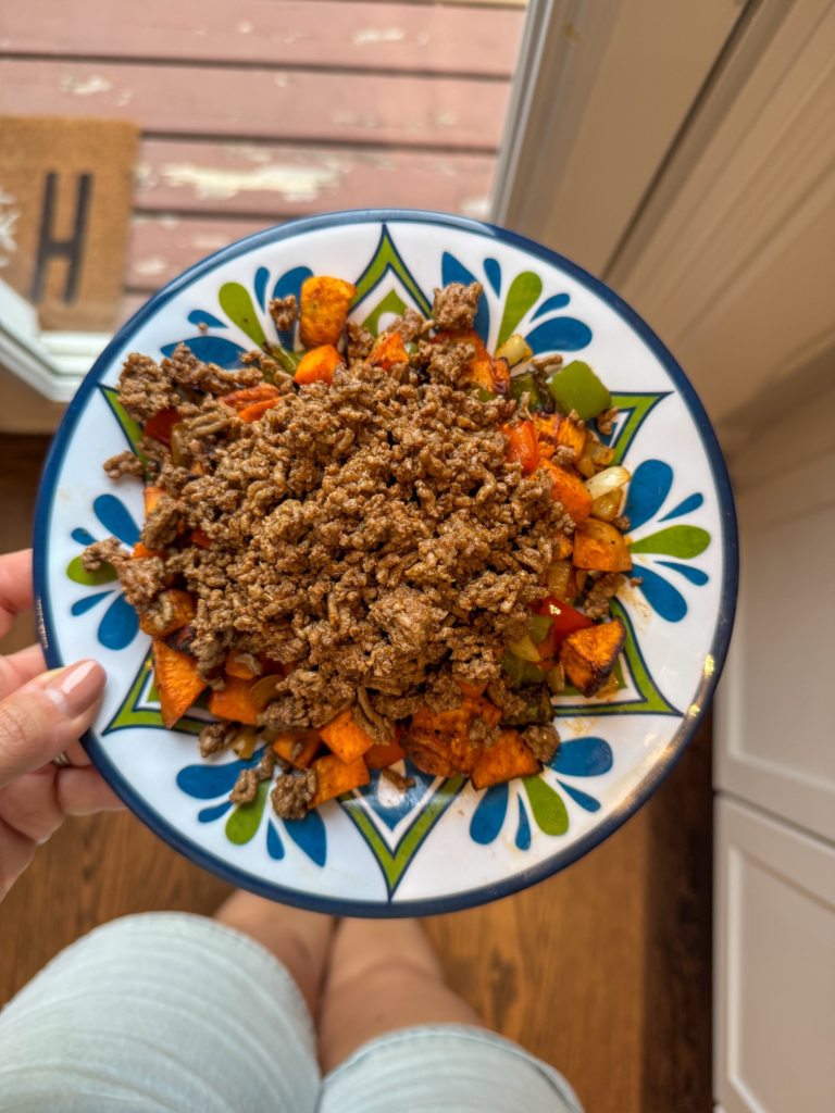 Roasted sweet potatoes and peppers topped with seasoned taco beef