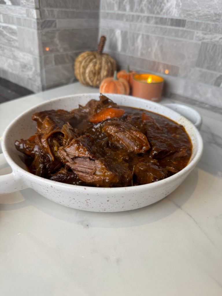 A bowl of tender braised beef ribs in rich sauce