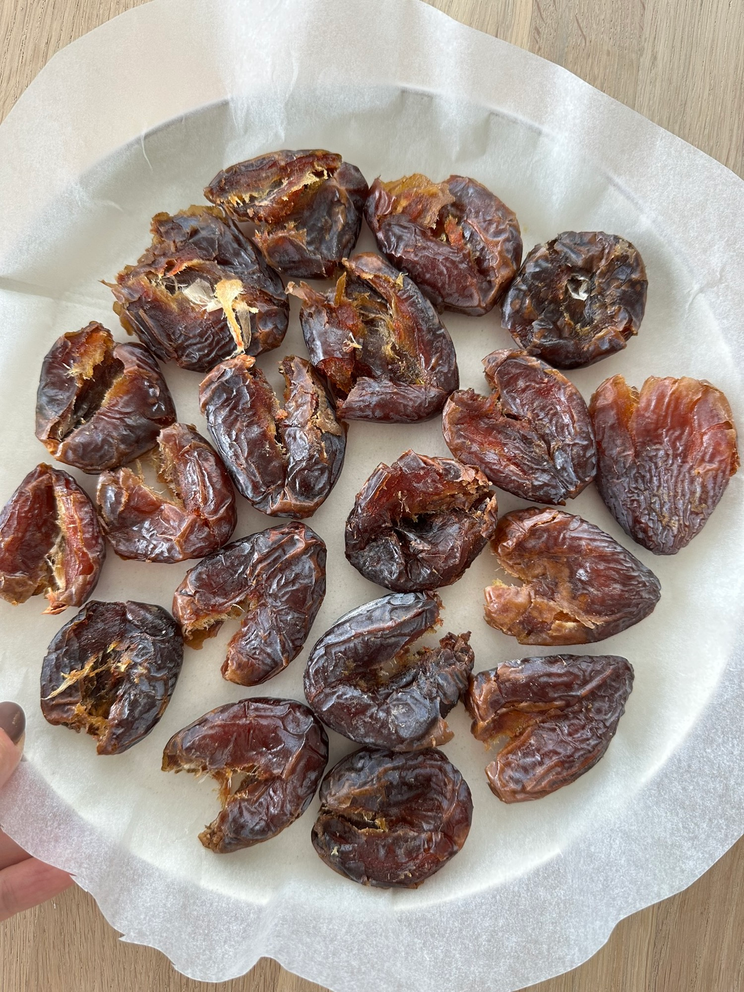 Peanut butter spread over flattened dates for date bark