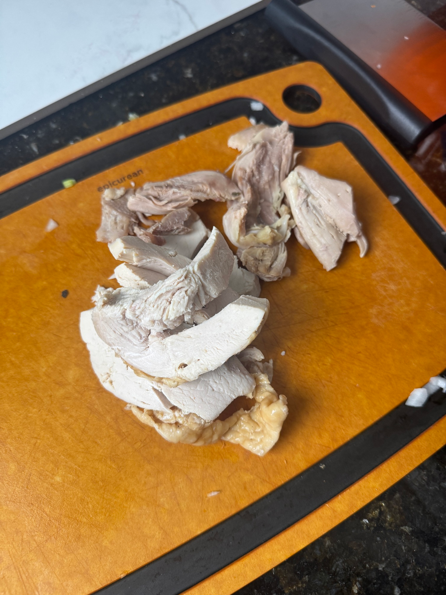Sliced leftover turkey on a cutting board