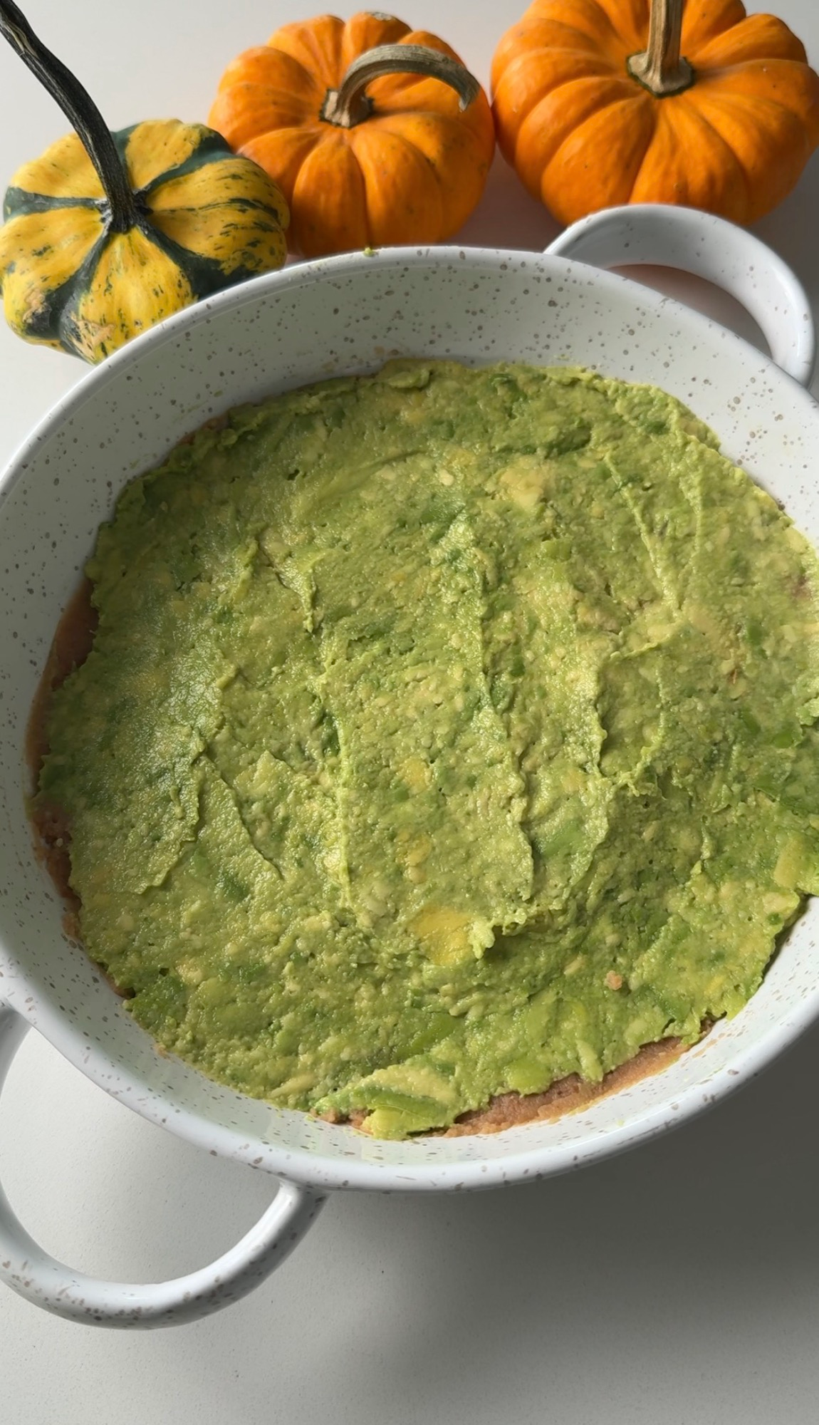 Guacamole layer spread over the dip