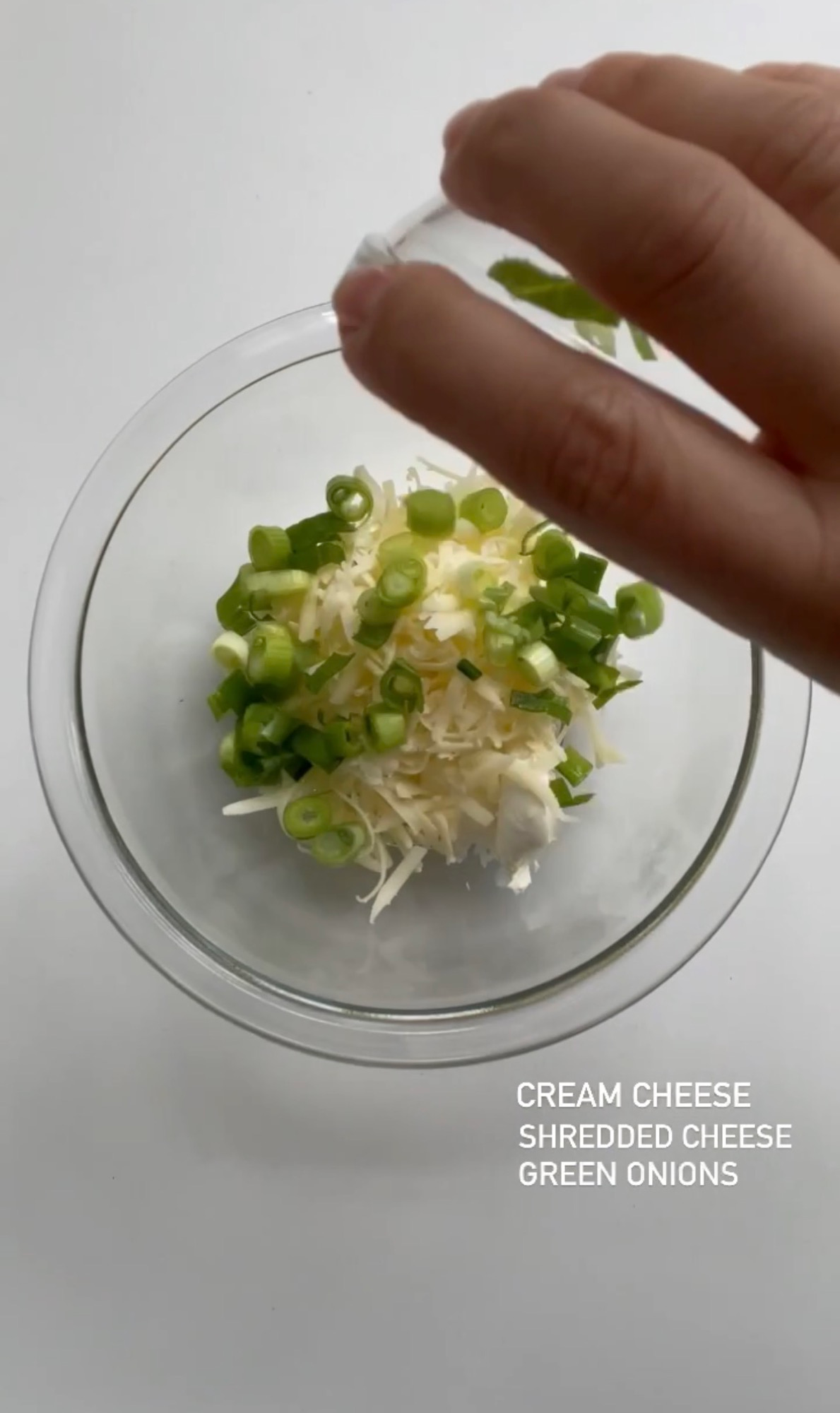 Cream cheese, shredded cheddar, and green onions for jalapeno popper filling