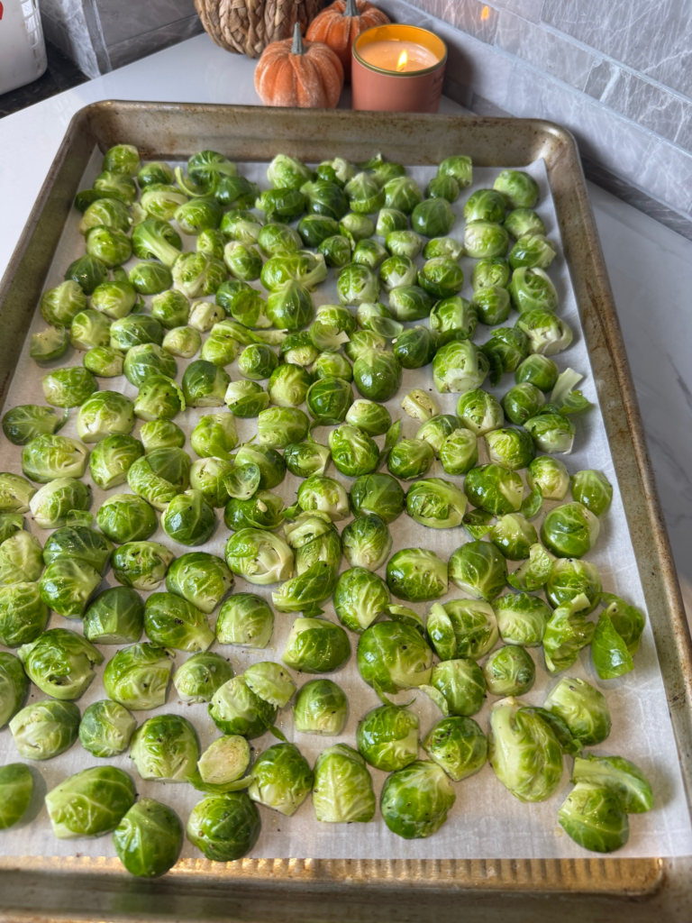 Maple bacon brussels sprouts cut-side down on a sheet pan before roasting