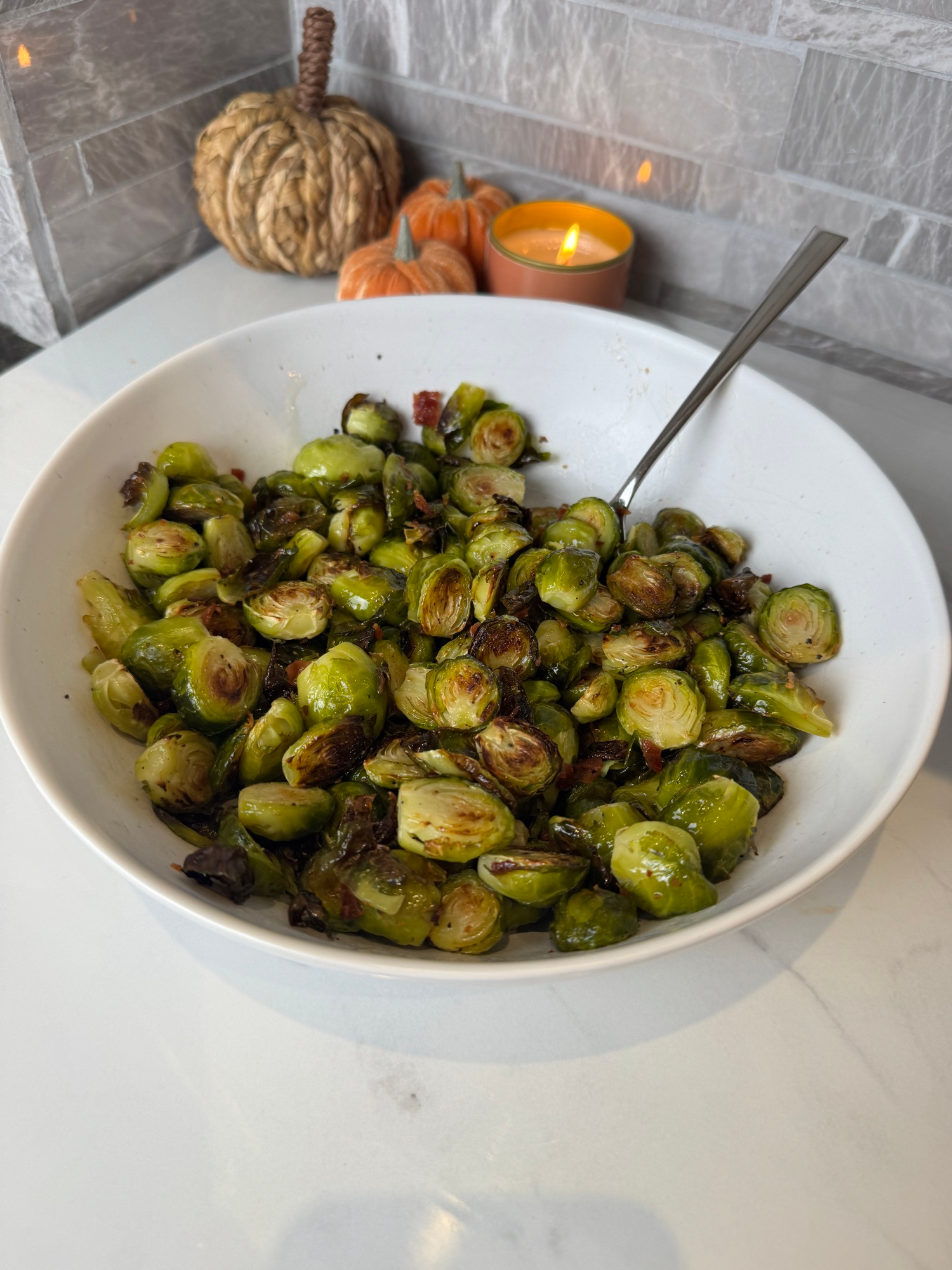 Maple bacon brussels sprouts in a white serving bowl