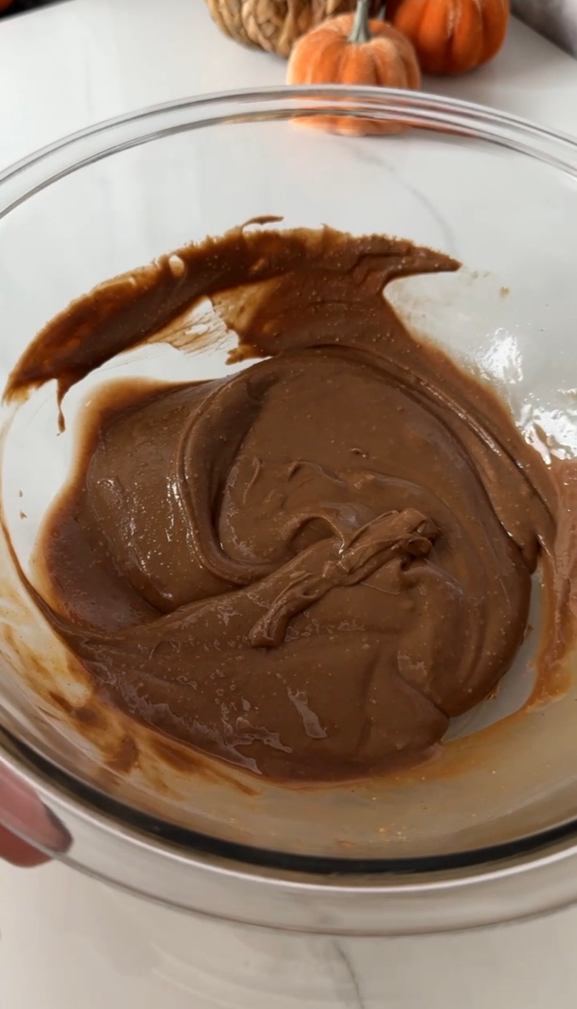 Smooth melted chocolate and peanut butter mixture in a bowl