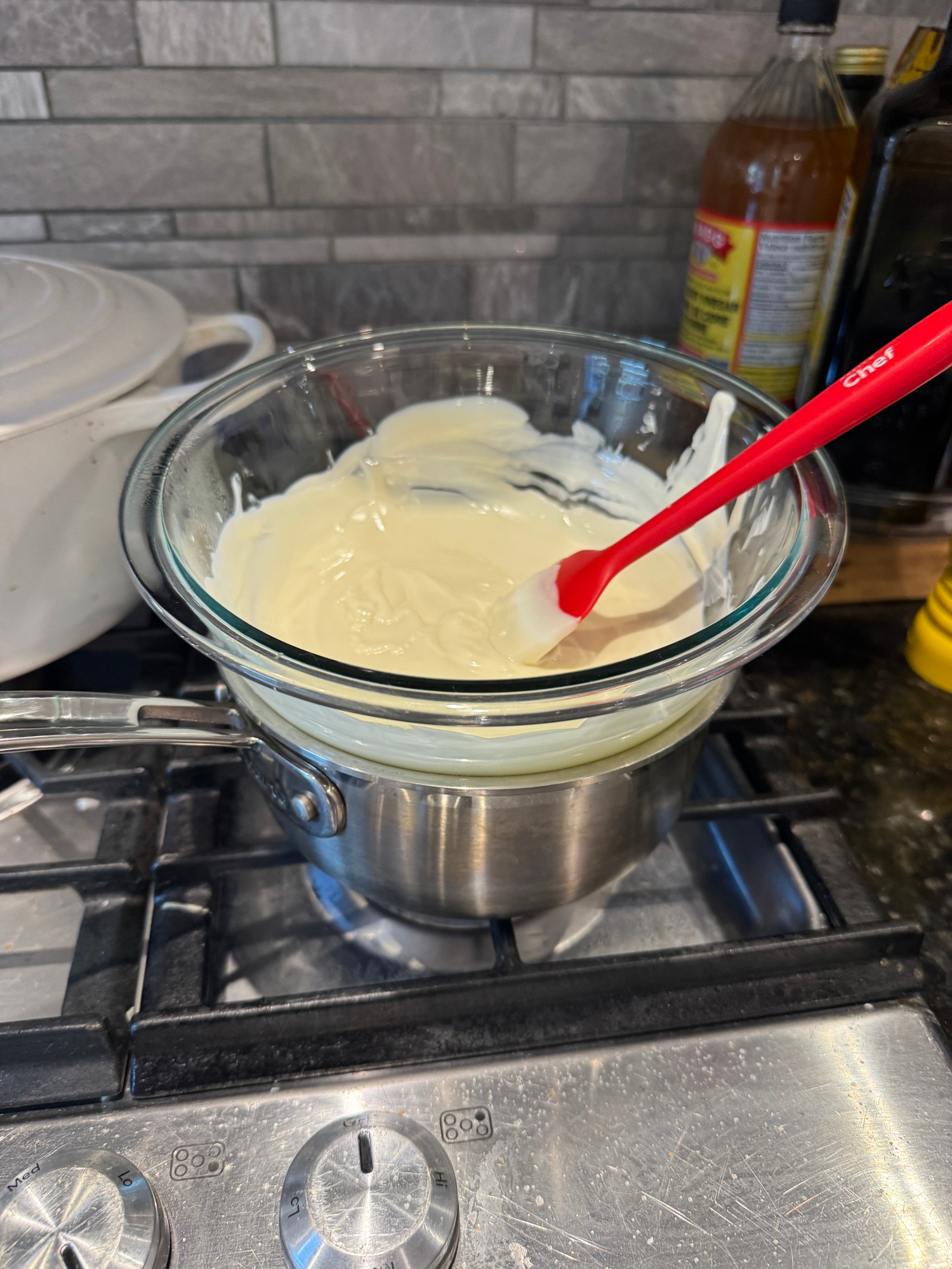 White chocolate melting in a glass bowl