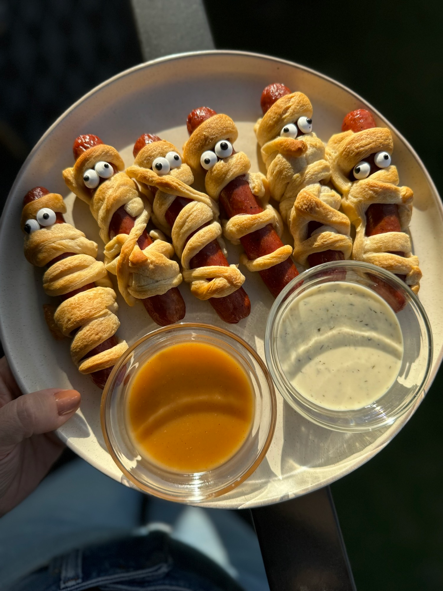 A platter of mummy dogs with honey dijon and ranch dipping sauces