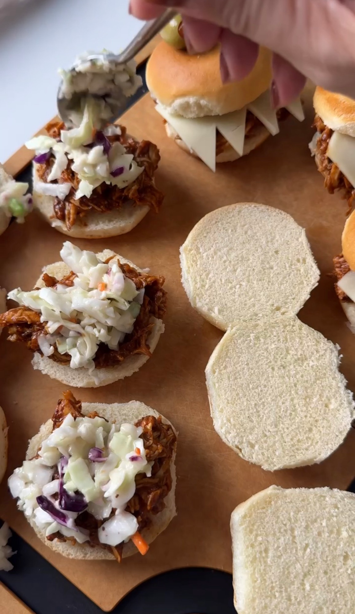 Spooky BBQ chicken sliders with provolone monster teeth and coleslaw